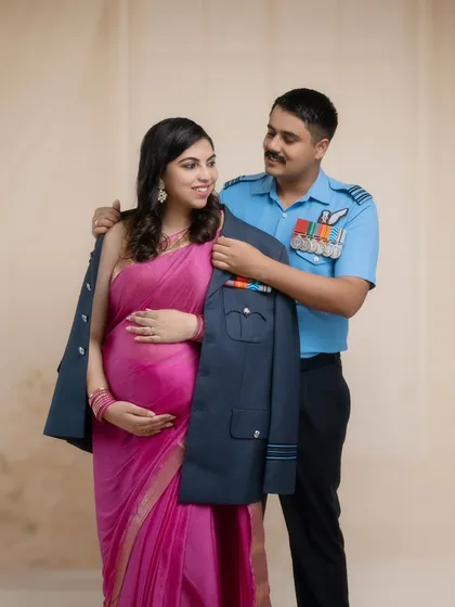 He gently places his service coat around her, a gesture of protection and shared identity. This portrait is a beautiful tribute to their life of service and the new life they are creating together.