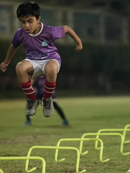 Explosive power in action. This young wolf is developing his vertical jump and coordination with plyometric hurdle drills.