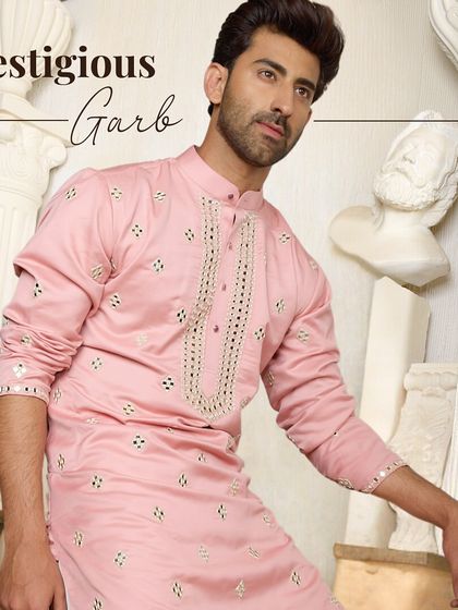 Prestigious Garb. This striking pink kurta with delicate mirror work is designed to let you own the moment with confidence and style.