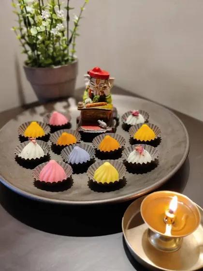 This festive arrangement displays the variety of my chocolate modak collection. They are perfect for puja rituals or as a sweet treat during the Ganesh festival, offering something new and exciting for everyone to enjoy.
