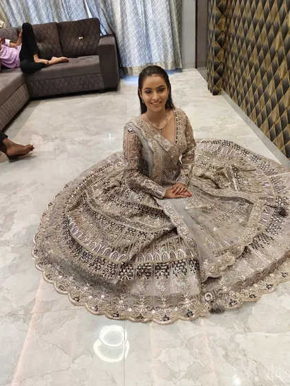 The same client showing the full flare of the grey and silver lehenga skirt.