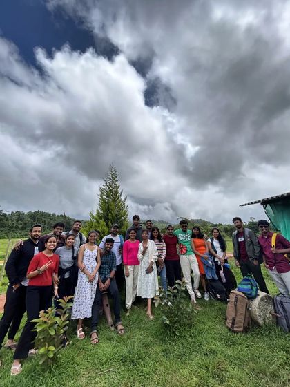 A happy group photo in the garden of our homestay.