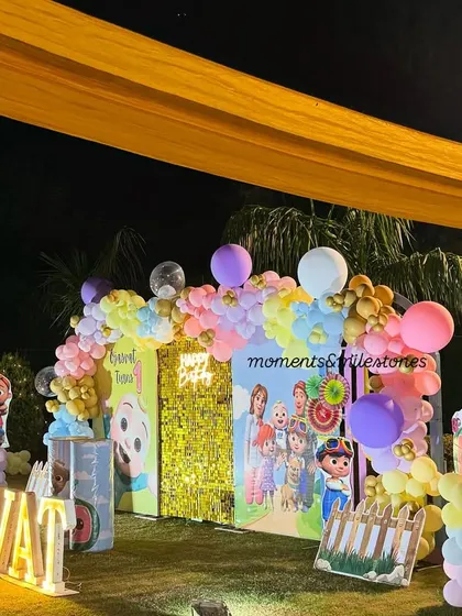 This shot shows the Cocomelon setup under festive yellow draping, demonstrating how we adapt our decor to different venue styles.