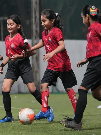 Our girls' team in action, working on their passing and movement in a small-sided game. We provide an inclusive environment where all players can thrive.