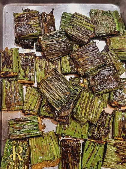 I love creating unique vegetarian appetizers. This is my popular paneer starter, marinated and grilled inside banana leaves, which imparts a subtle, smoky flavor. It's a dish that always gets guests talking.