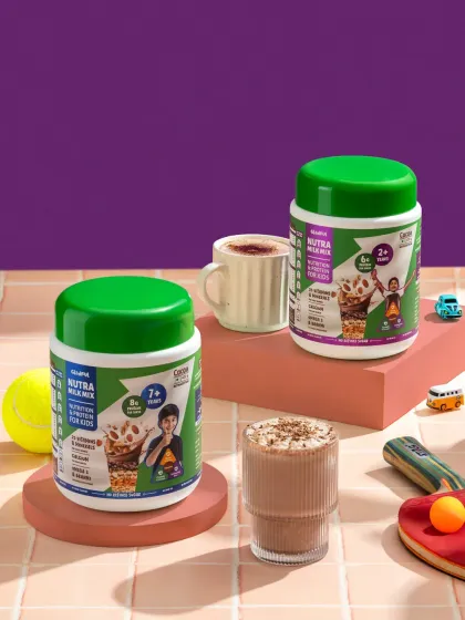 A playful shot of a kids' nutrition mix, styled with toys like a tennis ball and ping pong paddle.