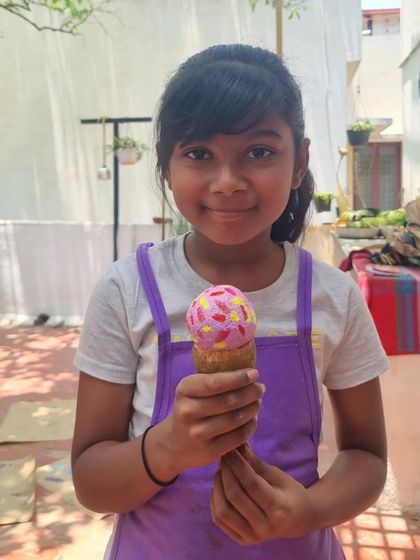This delightful ice cream cone is actually a paper mache sculpture. It's a testament to the wonderful creativity that flourishes in our kids' workshops.