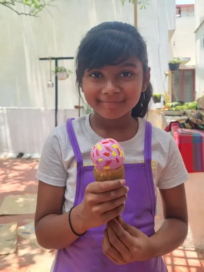 This delightful ice cream cone is actually a paper mache sculpture. It's a testament to the wonderful creativity that flourishes in our kids' workshops.