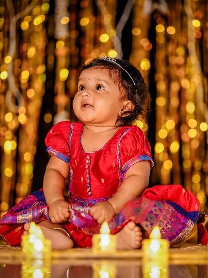 Our little light is shining brighter this Diwali. The glow of the diyas makes for a beautiful, warm portrait.