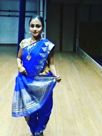 Dressed in a traditional blue saree for a Bharatanatyam fusion performance. We pay close attention to authentic costumes and presentation for our cultural dance acts.