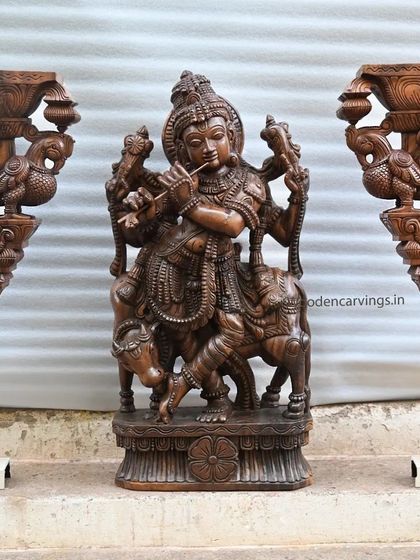 A 36-inch standing Krishna statue flanked by two 24-inch Annapakshi wall brackets. This arrangement shows how you can create a complete and majestic altar space with our carvings.