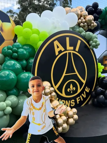 A personalized touch for the football party, with a cutout of the birthday boy in action, placed right on the main stage.