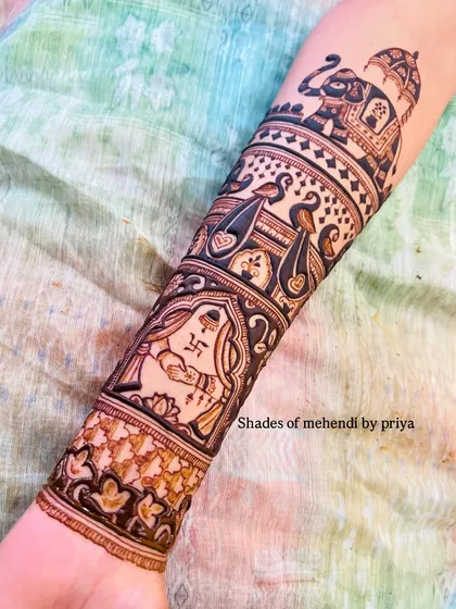 The lower section of the arm design, featuring a bride with a swastika symbol for good fortune, surrounded by peacock and geometric patterns.