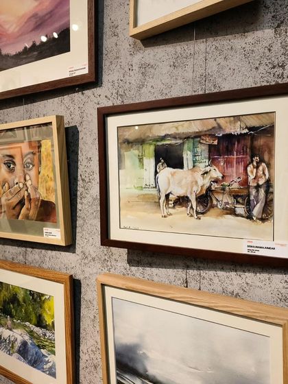 My painting in context on the gallery wall, showing the diversity of styles and subjects at the international show.