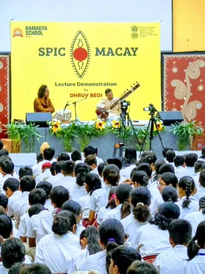 On stage for a SPIC MACAY event, with cameras set up to capture the session. We often record these workshops to make them available to a wider audience.