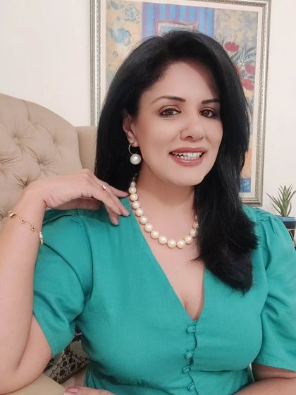 For a jazz concert followed by dinner, I wore this beautiful teal green maxi dress. I accessorized with a classic pearl necklace and earrings for a touch of timeless elegance.