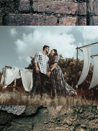 A wide shot of a couple in a rustic, outdoor setting, creating a sense of adventure for their pre-wedding story.