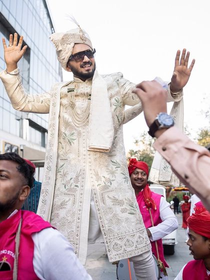 The groom in full celebration mode during his baraat.