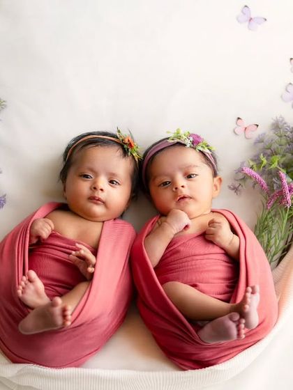 Double the love, double the joy. Capturing these beautiful twin newborn girls, nestled together in a sling, was an absolute honor.