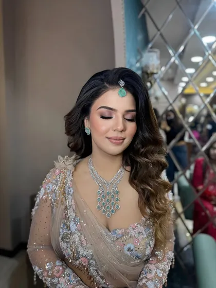A close-up of the soft glam look with eyes closed, showing the subtle shimmer on the lids. This is a perfect example of my signature "goddess glow".
