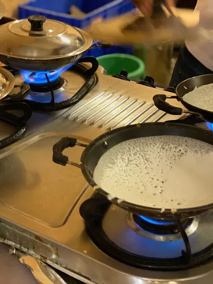 A glimpse of our live appam station in action. We bring the authentic taste of South Indian cuisine directly to your event, ensuring every serving is fresh, hot, and made right before your eyes.