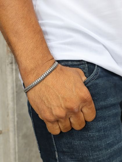 This woven-style sterling silver bracelet offers a more casual yet refined look. It is perfect for the dad who appreciates subtle, handcrafted details.