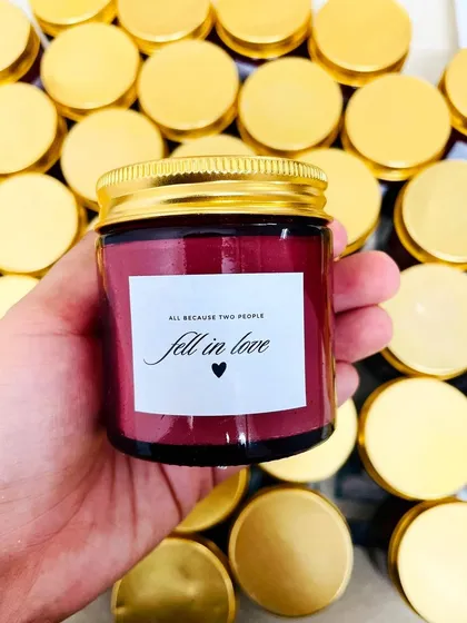 "All because two people fell in love." This custom-labeled jar candle is a romantic and sweet favor idea for weddings, engagement parties, or anniversaries.