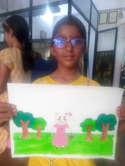 Khevana, a 6th standard student, created this drawing of a rabbit in a field. She used watercolors to create a soft and gentle scene.