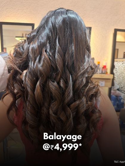 A beautiful balayage with soft, flowing curls. This offer highlights one of our most popular and timeless colouring services.