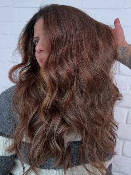 This rich, warm brown was created with Redken color. The result is a beautiful, healthy-looking color that has depth and shine.