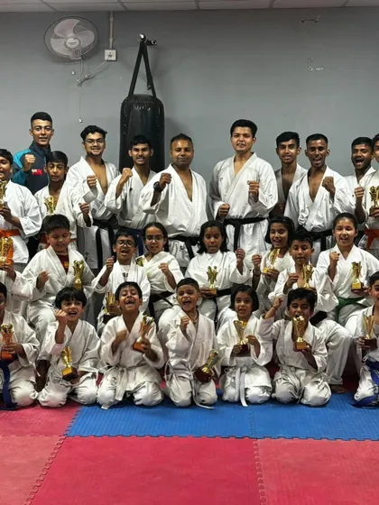 Our academy is a family of champions, from the youngest kids holding their first trophies to the senior athletes. This photo captures the spirit of our team after a successful competition, celebrating together.