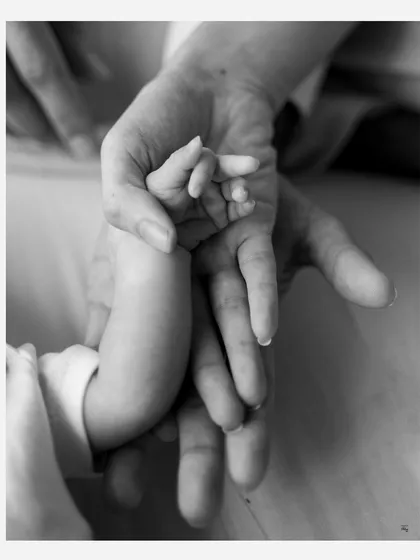 Sometimes the most powerful stories are told in the tiniest details. A newborn's hand wrapped around a parent's finger is a simple, soul-filled moment that speaks volumes about connection and love.