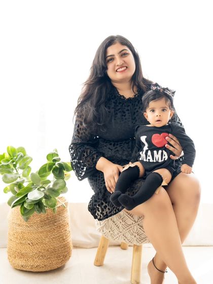 A lovely portrait of a mother and daughter in matching black outfits. A modern and stylish take on the 'Mommy and Me' session.