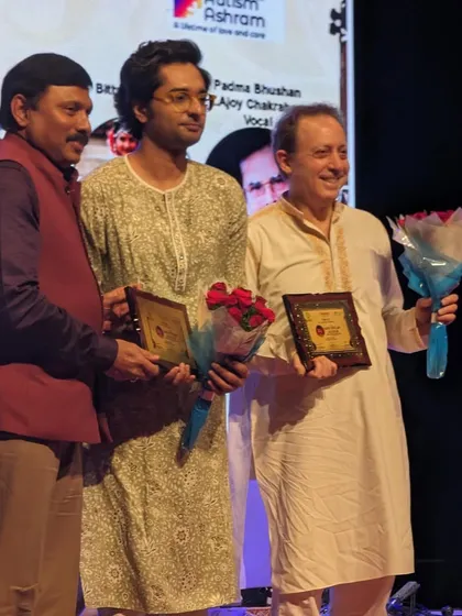 Receiving a token of appreciation alongside Ken Zuckerman ji after our performance at a festival in Hyderabad.