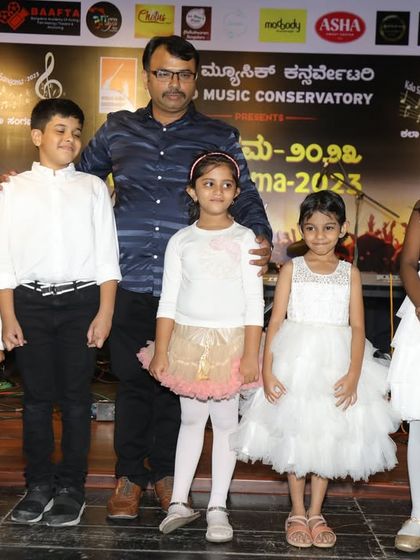 A group of our youngest keyboard students posing with their teacher after their heartwarming performance of "Meri Maa" at Kalaa Sangama 2023.