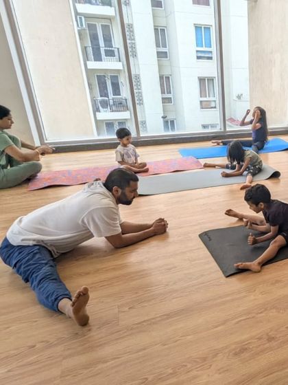 This photo shows me leading by example, stretching alongside my students. We create a collaborative environment where everyone works together to improve their flexibility and strength.