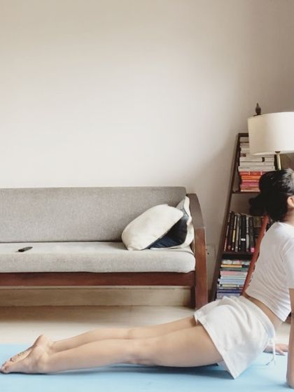 Demonstrating the correct alignment for Upward-Facing Dog, a key pose for strengthening the spine and opening the chest. Notice how the legs and pelvis are lifted off the mat.