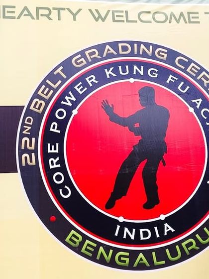 An instructor posing at the 22nd Belt Grading Ceremony, ready for the day's events.