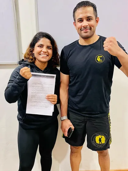 We build champions from the ground up. This is one of our own, signing her contract for Road to UFC. When you train with us, you're learning from coaches and training alongside athletes who compete at the highest levels.