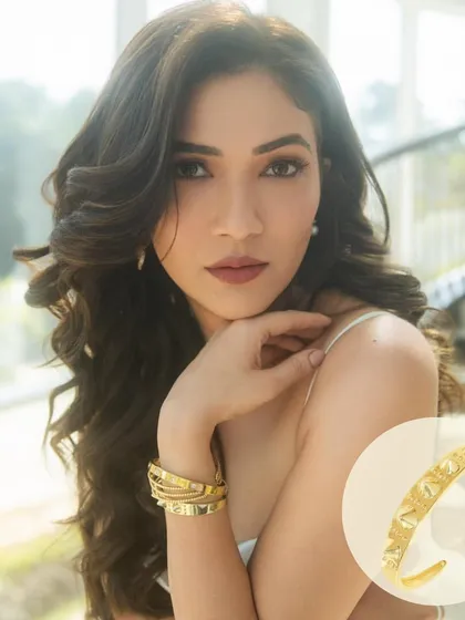 Another gorgeous shot of Ridhima Pandit in our gold bangle stack. Her look is the definition of elegance and power.