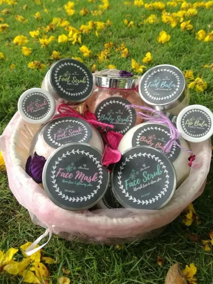 A basket full of my handmade skincare goodies. You can see my lip scrubs, face masks, body scrubs, and foot balms all ready to go. Each product is made with 100% natural ingredients to nourish your skin from the outside in.