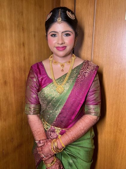The complete look, showing how the makeup, jewelry, and saree come together to create a stunning and traditional South Indian bridal aesthetic.