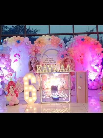 A duplicate image of the elaborate doll and fairy-themed 6th birthday stage.