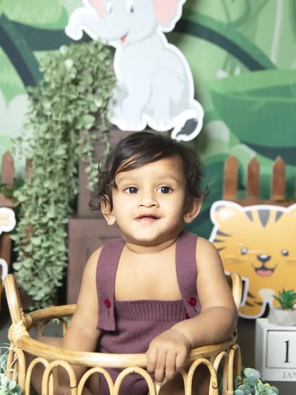 A happy smile from the birthday boy during his jungle-themed photoshoot.