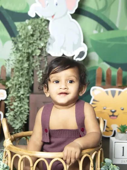 A happy smile from the birthday boy during his jungle-themed photoshoot.