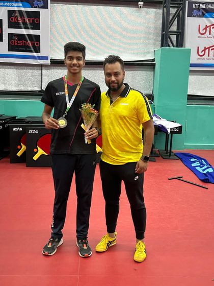 A duplicate image celebrating with Akash K J after his bronze medal win.