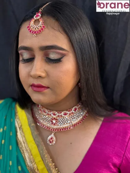 Eyes closed, this shot gives a clear view of the eyeshadow blending and lash application, key skills for any makeup artist.
