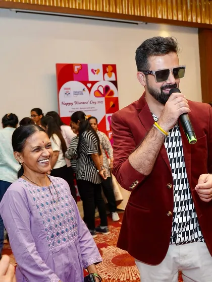 Sharing a smile and a song with one of the attendees at the HPCL celebration.