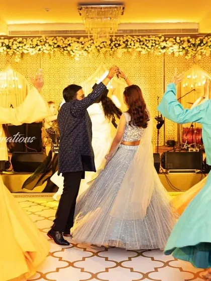 The whirling dervishes spin in a blur of color around the couple. This artistic and spiritual performance style offers a sophisticated and memorable alternative to a typical sangeet entry.