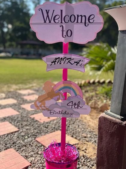 A personalized welcome signpost for Anika's 4th birthday unicorn party, guiding guests to the magical celebration.